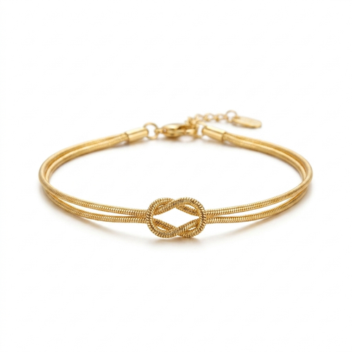 Gold geometric snake bone bracelet clean product shot
